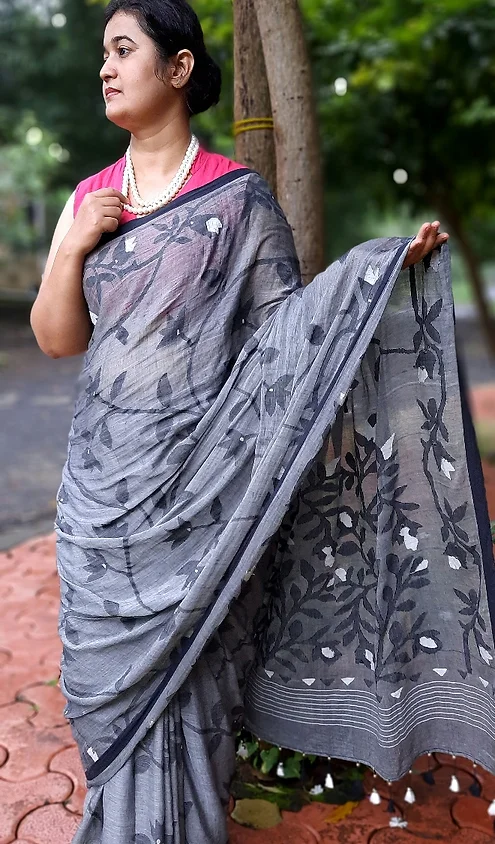 Handloom-Bengal-Cotton-Jamdani-2 Grey handloom Bengal cotton Jamdani saree with floral woven motifs and soft textured drape, worn by woman