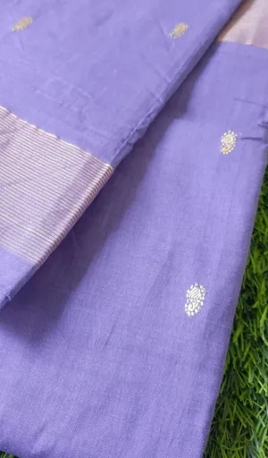 Handloom cotton Paithani fabric in purple with intricate gold motifs and a striped border.