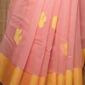 Handloom cotton silk Chanderi saree with a pink body and yellow floral patterns, featuring a contrasting yellow border.