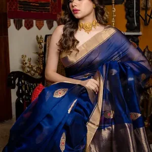 Navy blue Chanderi handloom cotton silk saree featuring rich golden zari pallu and traditional butti work.