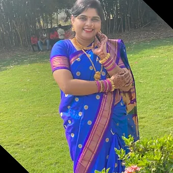 Blue Handloom Cotton Silk Himroo Saree with Golden Polka Zari Design Woman wearing a bright blue Himroo cotton silk saree featuring golden circular motifs, rich pink-gold zari border and paired with matching blouse and traditional jewelry