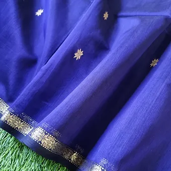Handloom-Cotton-Silk-Maheshwari-1 Royal blue handloom cotton silk Maheshwari saree with golden zari butti motifs and intricate zari border.