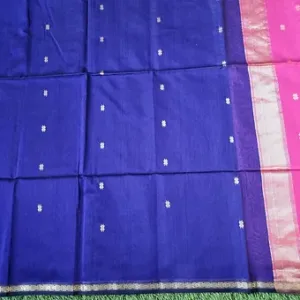 Royal blue Maheshwari handloom cotton silk saree featuring woven silver butti designs and a pink zari pallu border.