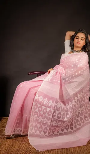 Light pink handloom Dhakai Jamdani saree with delicate floral motifs and geometric woven pallu, worn by woman