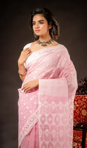 Light pink handloom Dhakai Jamdani saree with delicate white floral motifs and traditional woven pallu, worn by woman