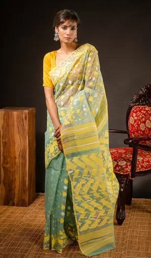Green and yellow handloom Dhakai Jamdani saree with geometric and floral motifs, worn by woman in traditional style