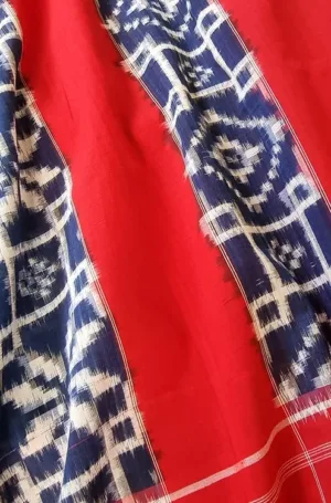 Red handloom double ikat cotton saree with indigo blue woven border and geometric motifs