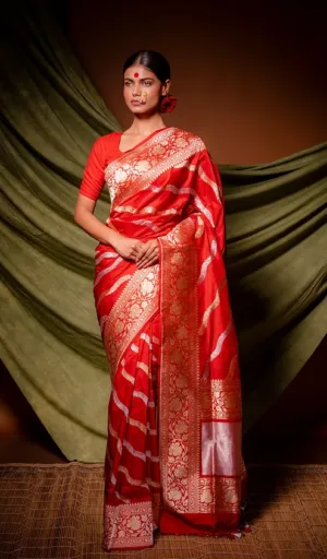 Red handloom Katan silk Banarasi saree with gold kadhua stripe weaving, rich floral zari border and traditional drape