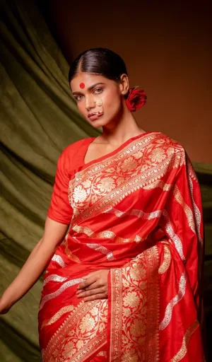 Red handloom Katan silk Banarasi saree with traditional gold kadhua stripe weaving and ornate floral zari border