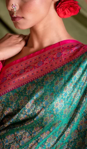 Teal green handloom Katan silk Tanchoi Banarasi saree with intricate floral zari weaving and rich pink Banarasi border