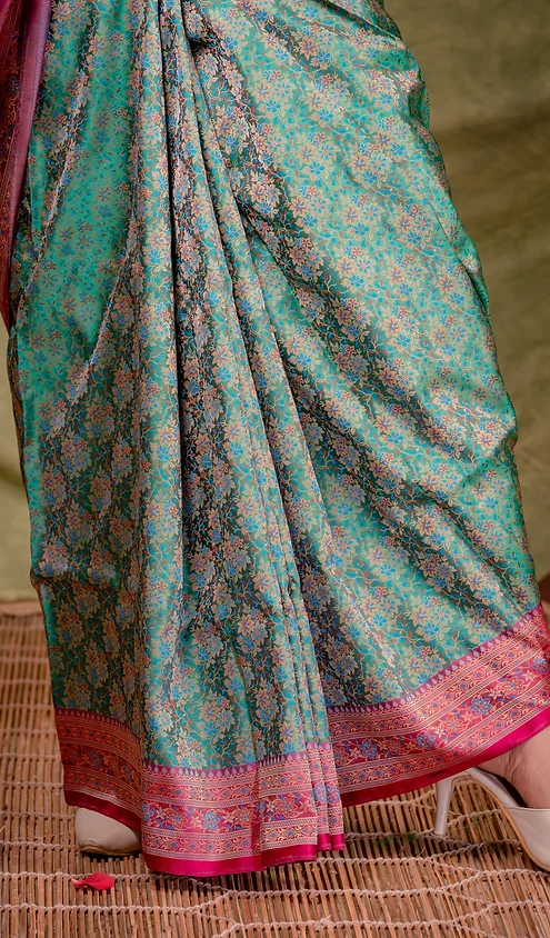 Handloom-Katan-Silk-Tanchoi-Banarasi-3 Teal green handloom Katan silk Tanchoi Banarasi saree with dense floral zari weaving and pink traditional Banarasi border