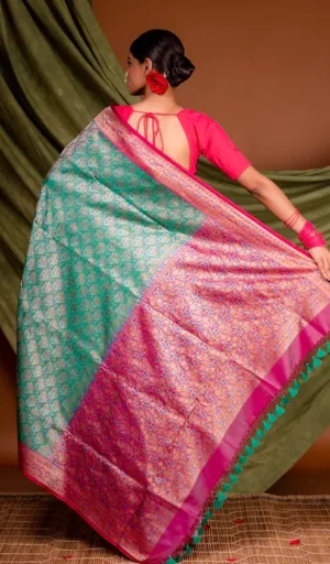 Teal green and pink handloom Katan silk Tanchoi Banarasi saree with intricate all-over zari weaving and traditional Banarasi pallu