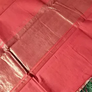 Handloom Mangalagiri saree with a nizam border in a vibrant red color, showcasing intricate weaving and texture.