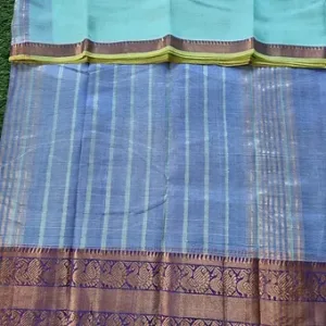 Light blue Mangalagiri handloom cotton saree with zari striped body and traditional purple Kanchi border with golden motifs.