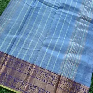 Sky blue Mangalagiri handloom cotton saree with zari stripes and traditional purple Kanchi border.