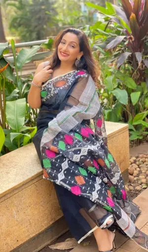 Black handloom pure cotton Jamdani saree with multicolour floral motifs and sheer textured weave, worn by woman