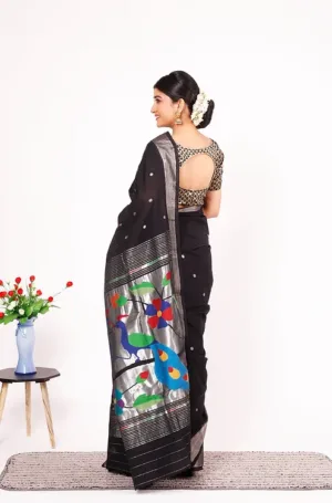 Black handloom pure cotton Paithani saree with silver border and multicolour peacock pallu, worn by woman