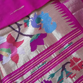 Handloom-Pure-Cotton-Paithani-Saree-3 Handloom pure cotton Paithani saree with intricate floral patterns and vibrant colors, showcasing traditional Indian textile artistry.