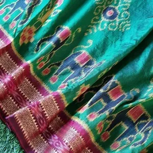 Green Odisha Ikat pure silk saree with traditional multicolour elephant motifs and maroon contrast border.