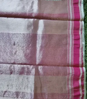 Handloom silk Chanderi saree with a combination of maroon and gold tones, featuring subtle patterns and borders.