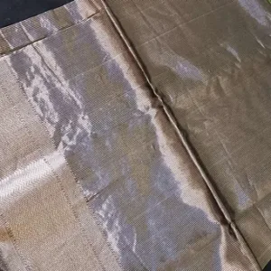 Handloom cotton silk Maheshwari saree in muted olive beige tones, featuring a soft silver zari panel and a finely woven traditional border