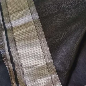 Handloom cotton silk Maheshwari saree in deep charcoal black with a broad silver zari border featuring classic chevron woven patterns