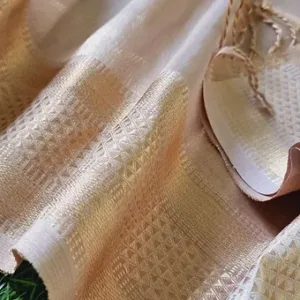 Close-up view of an authentic handloom cotton silk Maheshwari saree showcasing intricate gold zari weaving and classic geometric patterns
