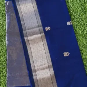 Handloom cotton silk Maheshwari saree in deep royal blue featuring a silver zari border and small traditional buti motifs woven across the body