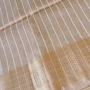 Handloom cotton silk Maheshwari saree in beige with white vertical stripes and traditional zari border