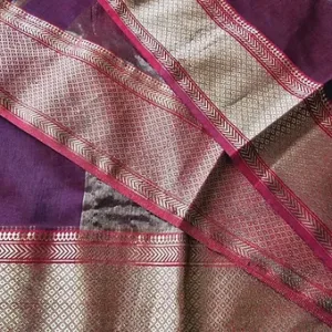 Purple handloom cotton silk Maheshwari saree with intricate silver zari work and pink border detailing, displayed flat; elegant traditional Maheshwari saree design.