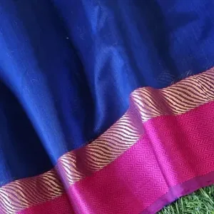 Handloom cotton silk Maheshwari saree in deep royal blue featuring a broad pink resham border with metallic chevron weave