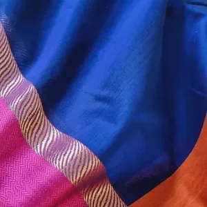Handloom cotton silk Maheshwari saree in royal blue with a vibrant pink resham border and subtle metallic chevron weave