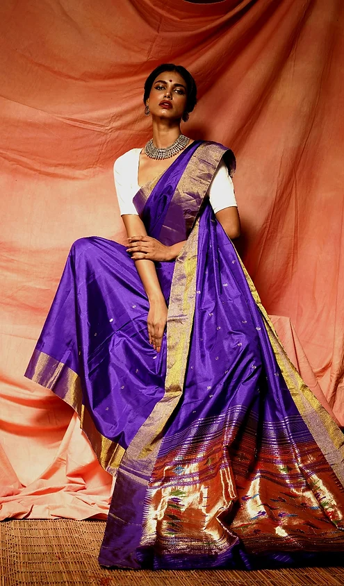 Handloom-fusion-chanderi-paithani-1 Royal purple handloom fusion Chanderi Paithani saree with gold zari border, worn by woman in elegant traditional style