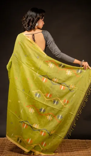 Woman wearing green handloom pure cotton Jamdani saree with multicolour woven motifs