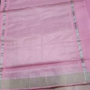 Close view of a pastel pink Mangalgiri handloom pure cotton saree featuring a soft textured weave and a subtle silver zari border with fine detailing, displayed on a plain background.