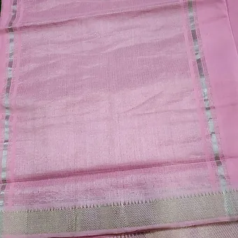 Pastel Pink Pure Cotton Mangalgiri Saree with Silver Zari Border Close view of a pastel pink Mangalgiri handloom pure cotton saree featuring a soft textured weave and a subtle silver zari border with fine detailing, displayed on a plain background.