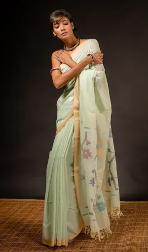 Woman wearing off-white handloom pure cotton Jamdani saree with floral woven motifs and zari border