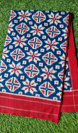 Handloom double ikat saree with a blue and red geometric pattern, featuring intricate designs on a cotton fabric.
