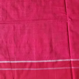 Pink handloom pure cotton double ikat saree with subtle woven texture and simple white border stripes, displayed flat; elegant lightweight traditional cotton saree.