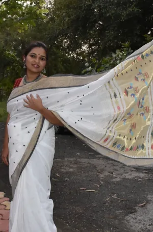 White handloom pure cotton Paithani saree with grey zari border and multicolour traditional pallu, worn by woman outdoors
