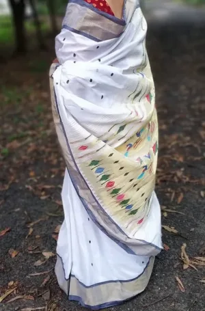 White handloom pure cotton Paithani saree with grey border and multicolour traditional pallu motifs, worn by woman