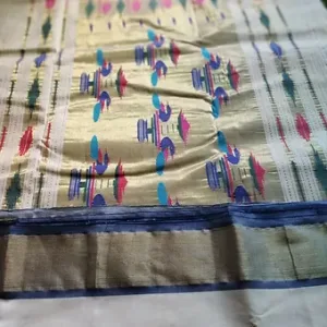 Handloom pure cotton Paithani fabric with intricate patterns in vibrant colors, featuring traditional motifs and a decorative border.