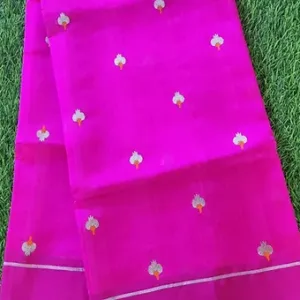 Handloom pure silk Chanderi fabric in vibrant pink with floral motifs and a decorative border.
