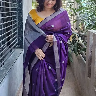 Handloom-pure-silk-chanderi-1 Woman wearing purple handloom pure silk Chanderi saree with silver zari border and butti motifs