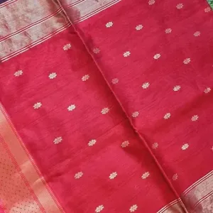 Red handloom pure silk Chanderi saree with delicate silver floral butti motifs and subtle zari border, displayed flat; elegant traditional festive silk saree.