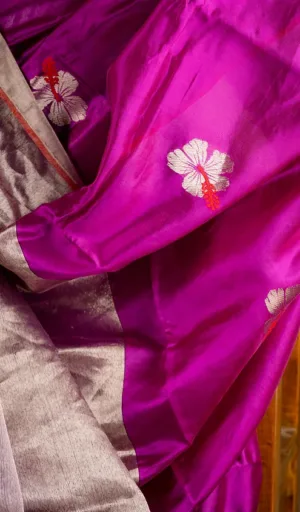 Handloom pure silk Chanderi saree in vibrant purple with floral embroidery and a contrasting silver border.