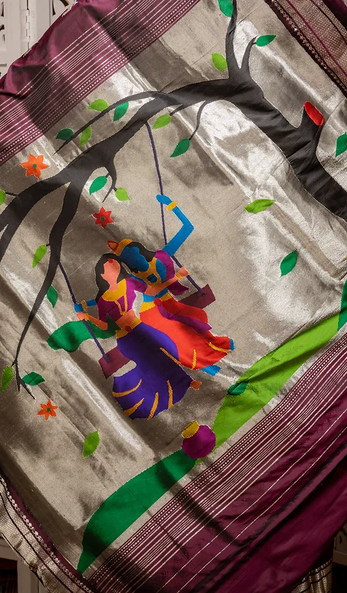 Handloom-pure-silk-paithani-3 Maroon and silver handloom pure silk Paithani saree with traditional Radha Krishna swing motif and handwoven scenic artwork