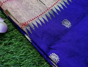 Royal blue handloom pure silk Paithani saree with silver zari border and traditional woven motifs