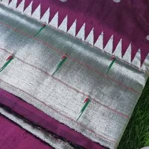 Handloom pure silk triple muniya Paithani fabric with intricate patterns in silver and purple hues, showcasing traditional textile craftsmanship.