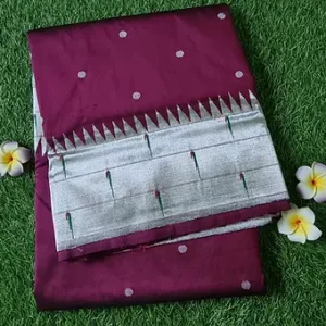 Handloom pure silk triple muniya Paithani fabric in deep maroon with silver accents and intricate patterns.